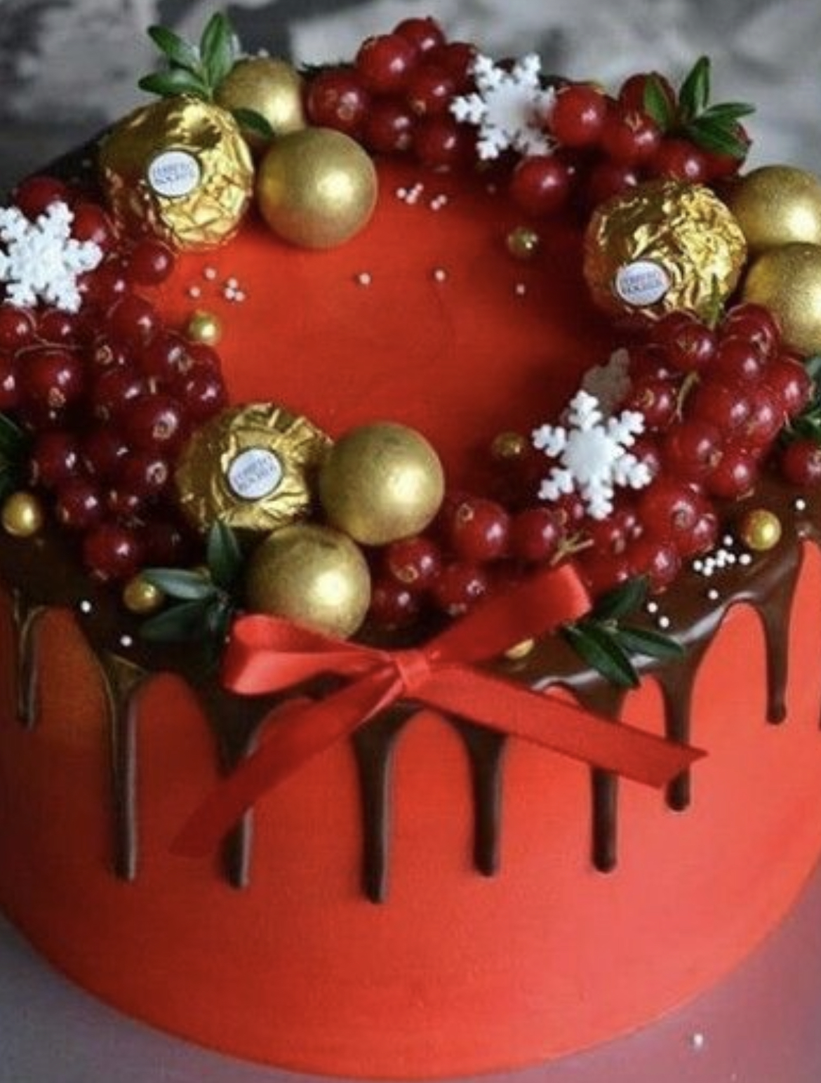 Photo of crimson winter themed cake, either sponge or luxury fruit cake. Suitable for Christmas of winter birthday/ occasion.