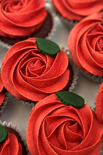 Photo of rose frosted cupcakes, show them that you love them with these rose topped cupcakes.